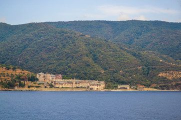 Fototapeta premium Orthodox Greek monastery on Mount Athos. View from sea. Xenophon.