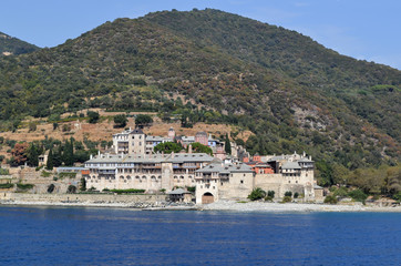 Fototapeta na wymiar Orthodox Greek monastery on Mount Athos. View from sea. Xenophon.