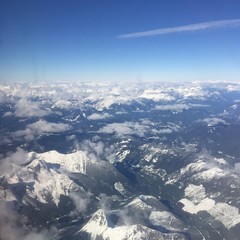 Aerial view of snow covered mountains