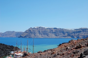 Coast of Santorini volcano, Greece. Caldera. Lifeless emissions of basalt, a reminder of the...
