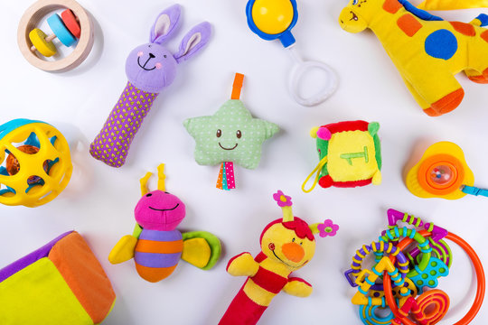 colorful baby toys on white. top view