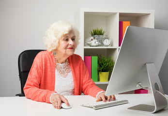 older woman working in the office