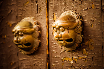 closeup of the antique oriental door knocker,suzhou city,china.