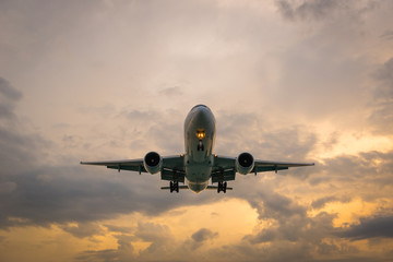 Landscape of sunset with Plane at Nai Yang Beach, Phuket Province, Thailand.