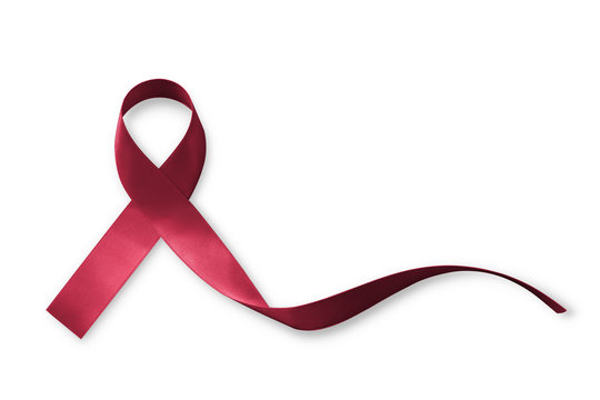 Burgundy ribbon for multiple myeloma cancer awareness isolated on white background (clipping path): Satin fabric symbolic concept raising public support campaign on patient's disease