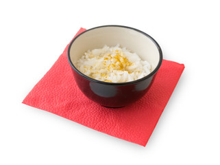 Rice and curry in black bowl on a red napkin