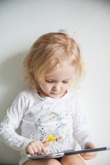 Fototapeta premium iPads little girl with white background human