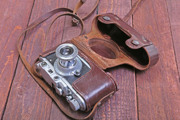 Vintage old film photo-camera in leather case