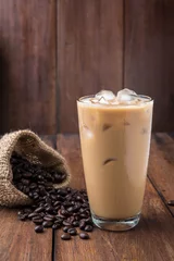 Tuinposter Glass Of Cold Coffee On Wood © penguiiin