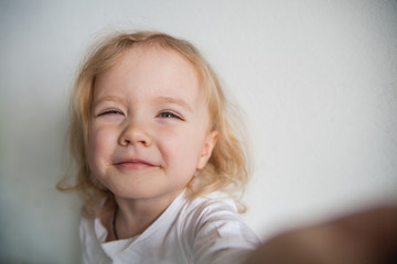 a beautiful little girl making a selfie