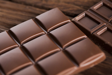 Bars Chocolate , candy sweet, dessert food on wooden background