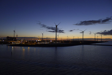 Fototapeta na wymiar Energy windmills in sunset
