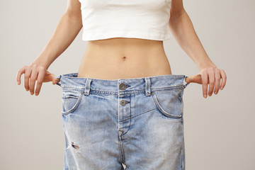 Weight loss woman with bluejeans
