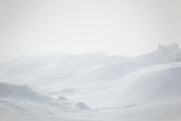 A beautiful, minimalist landscape of snowdrift in Norway. Clean, light, high key, decorative look.