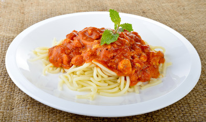 Spaghetti with tomato sauce close up