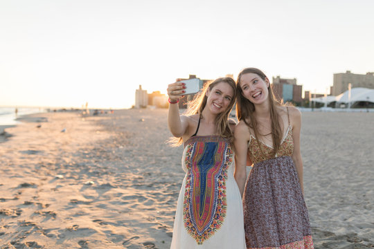Best Friends Taking a Picture with a Mobile Phone. Coney Island New York City US