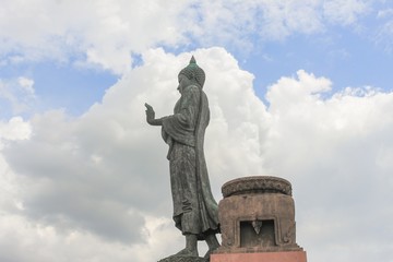 Big Buddha statue ancient on blue sky and raincloud background  in Nakhon Pathom Province of Thailand
