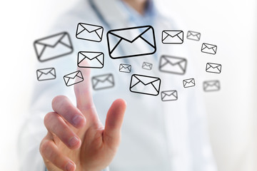 Concept of Doctor touching email icon on technology interface