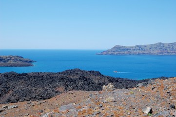 Coast of Santorini volcano, Greece. Caldera. Lifeless emissions of basalt, a reminder of the...