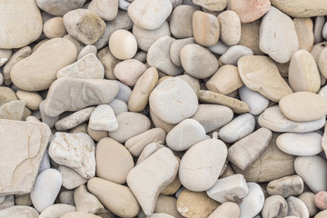 Large amount rounded and polished beach rocks