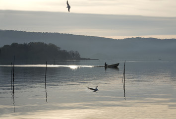 fisherman at lago Trasimeno Italy