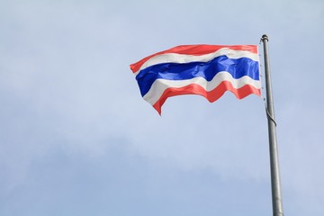 Thailand Flag Wave Flying with blue sky background.
