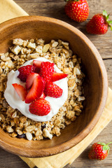 Homemade granola with yogurt and strawberries