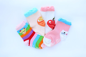 Baby socks on white background. Top view