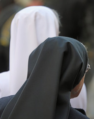 Sisters with black and white veil during the holy mass