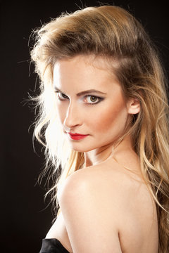 Young Woman with Blond Hair and Disco Makeup.