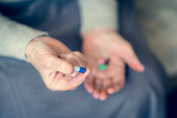 Senior woman holding tablets