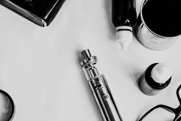 Vaping set and coffee on the white background. Hipster or bussinesman style. Trendy objects with...