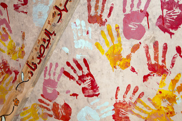 Painted prints from hands of  refugee children on Lesvos