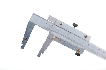 Close up of metal caliper on white