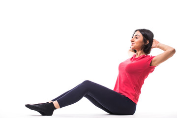 Fototapeta premium Portrait of sporty fit beautiful young brunette woman in sportswear bra and black pants working out isolated, white background