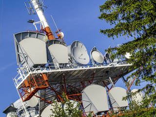 Radio tower with satellite dish