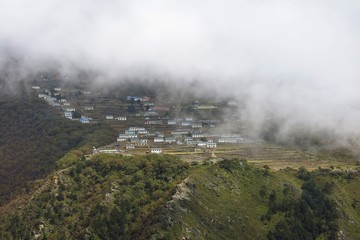 Sherpa village Phortse on a fogy day. Autumn scene in the Everest National Park.