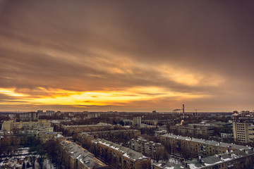 Aerial evening cityscape from rooftop of Voronezh. Houses, sunset, sky, clouds