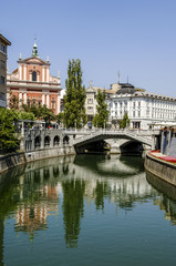 Fototapeta na wymiar Ljubljana, Tromostovje (Three Bridges, Plecnik), in background F