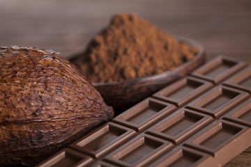 Chocolate bar, candy sweet, dessert food on wooden background