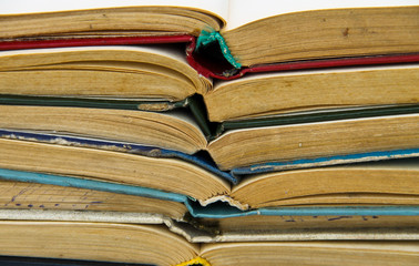 Stack of old open books. Books background