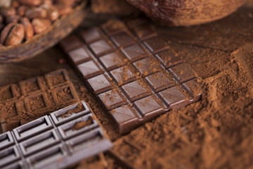 Chocolate bar, candy sweet, dessert food on wooden background