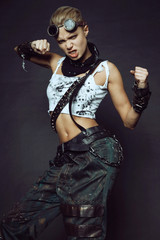 Fototapeta premium Young woman in brutal futuristic clothes