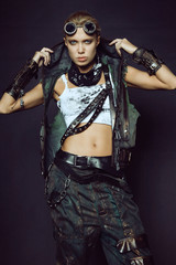 Young woman in brutal futuristic clothes