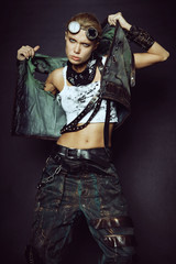 Young woman in brutal futuristic clothes