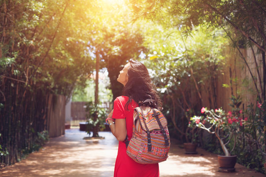 Young asian woman travel with backpack in city