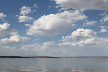 the sky reflected in the water, deserted beach lake, summer sky, nature, blue cloud,