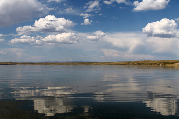 the sky reflected in the water, deserted beach lake, summer sky, nature, blue cloud,