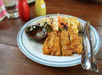 Fried pork steak on a table in a restaurant.