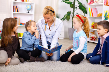 Teacher telling story to children
